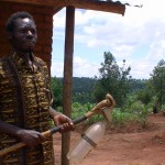 Frederick Msiska with his homemade chemical sprayer.